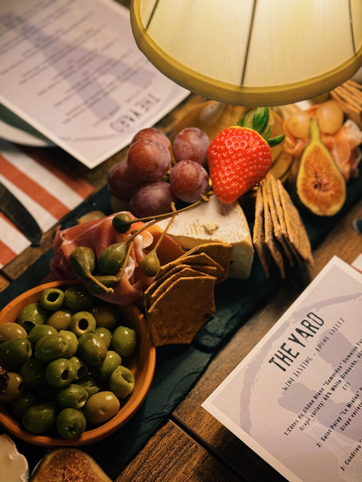 Bar setup with specialty drinks at The Yard Café evening event